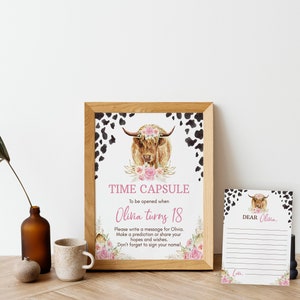 May include: A printable time capsule sign with a watercolor illustration of a Highland cow with a floral crown. The sign says "Time Capsule" and "To be opened when Olivia turns 18". There is a separate card that says "Dear Olivia" with lines for writing a message.