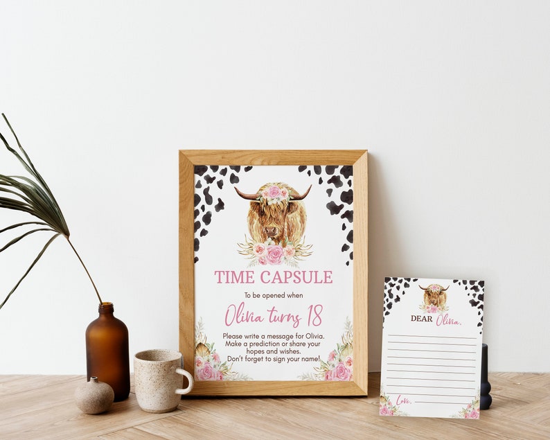 May include: A printable time capsule sign with a watercolor illustration of a Highland cow with a floral crown. The sign says "Time Capsule" and "To be opened when Olivia turns 18". There is a separate card that says "Dear Olivia" with lines for writing a message.
