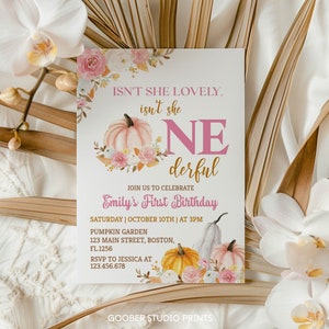 May include: A rectangular birthday invitation card featuring pink and orange pumpkins, floral accents, and the text: ISN'T SHE LOVELY, isn't she ONE derful, JOIN US TO CELEBRATE Emily's First Birthday, SATURDAY | OCTOBER 10TH | AT 3PM, PUMPKIN GARDEN.