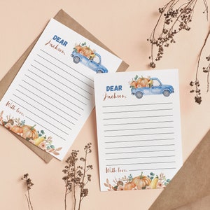 May include: Two white stationery sheets with horizontal lines, featuring a watercolor illustration of a blue pickup truck carrying pumpkins and autumn foliage. The text reads Dear Jackson and With love, accented by pumpkins and leaves at the bottom.