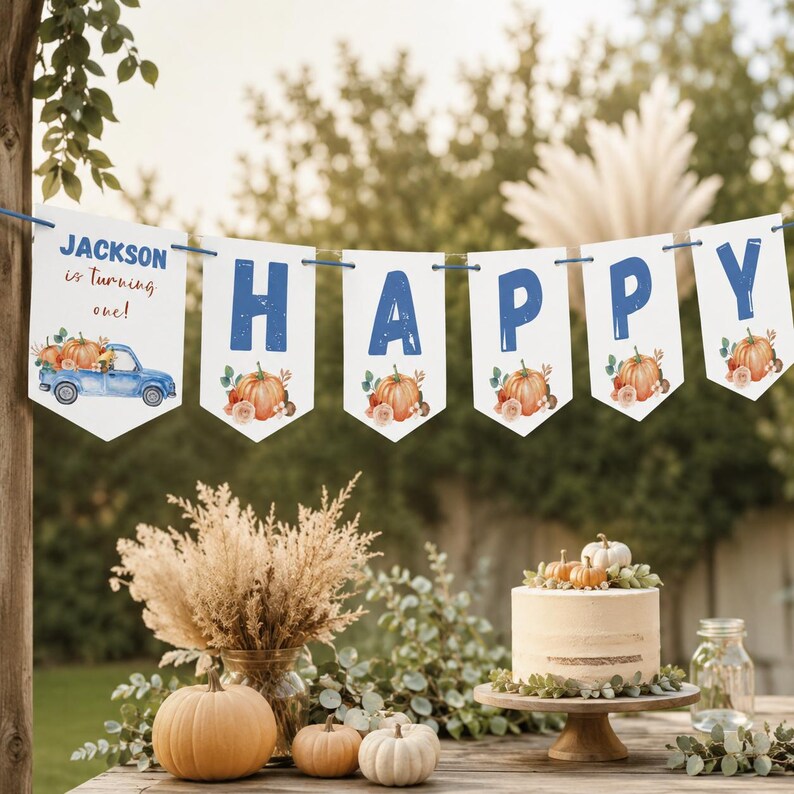 May include: A white pennant banner featuring blue letters spelling HAPPY and a blue truck graphic with pumpkins. The first flag displays the text JACKSON is turning one! Each flag is decorated with watercolor-style orange pumpkins and green leaves.