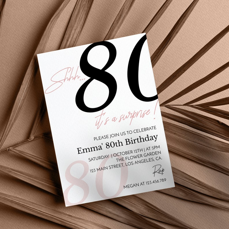 May include: A white rectangular birthday invitation card featuring large black text reading 80, with pink script text stating Shhh... it's a surprise! and Emma' 80th Birthday. Includes event details for Saturday, October 12th at 5PM at The Flower Garden.
