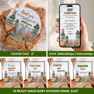 May include: A collection of baby shower decorations with a camping theme. Includes a favor tag, an Evite on a phone, and several signs. The signs read "Mommy Belly", "Pacifier Hunt", "Cards and Gifts", and "Diaper Raffle".