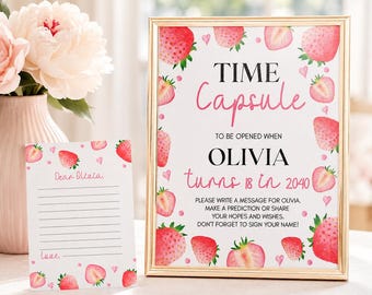 May include: A framed sign and a matching card featuring watercolor strawberry illustrations and pink hearts. The sign reads: TIME Capsule TO BE OPENED WHEN OLIVIA turns 18 in 2040. PLEASE WRITE A MESSAGE FOR OLIVIA. MAKE A PREDICTION OR SHARE YOUR HOPES AND WISHES.