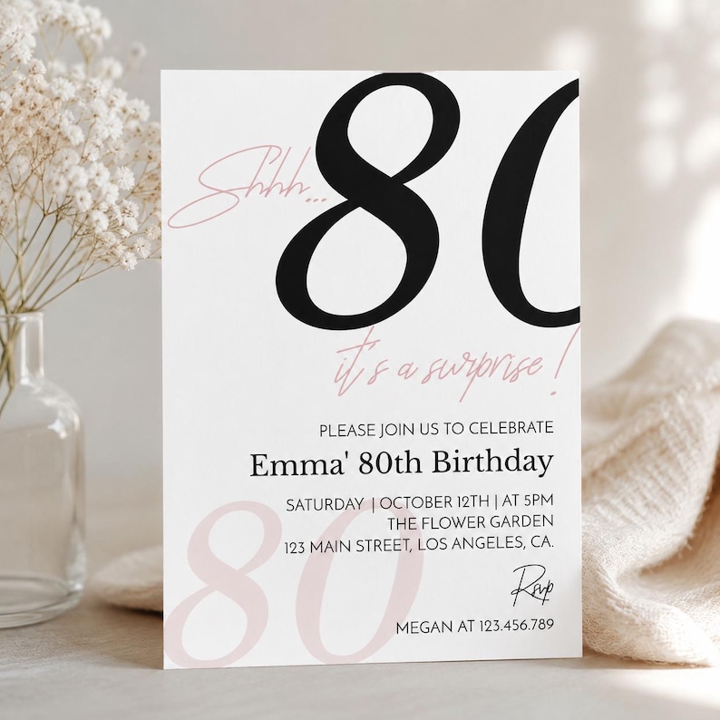 May include: A white rectangular birthday invitation card featuring large black numbers 80 at the top and light pink text that reads Shhh... it's a surprise! The card includes details for Emma's 80th birthday on Saturday, October 12th at 5PM.