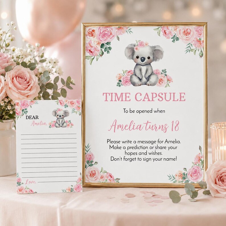 K&ouml;nnte beinhalten: Ein gerahmtes Schild und eine passende Karte mit einer Koala-Illustration und rosa Rosen. Das Schild tr&auml;gt die Aufschrift: TIME CAPSULE, To be opened when Amelia turns 18. Please write a message for Amelia. Make a prediction or share your hopes and wishes.