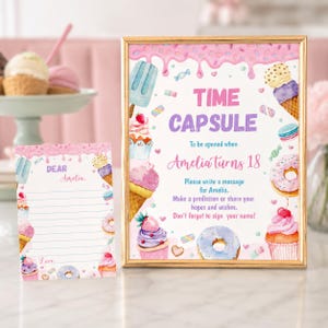 May include: A gold-framed sign and a matching card featuring watercolor illustrations of ice cream, cupcakes, and donuts. The sign reads: TIME CAPSULE To be opened when Amelia turns 18. Please write a message for Amelia. Make a prediction or share your hopes and wishes. Don't forget to sign your name!