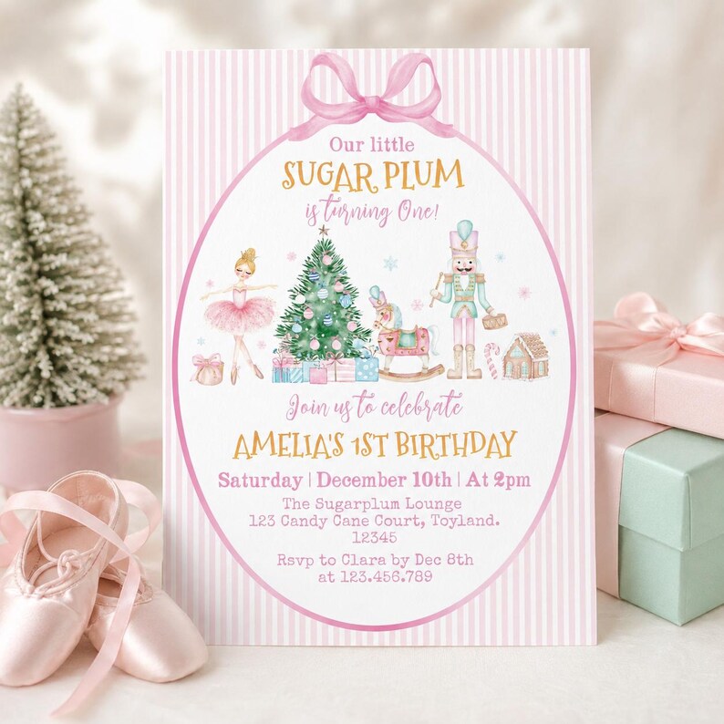 May include: A rectangular birthday invitation card with a pink and white striped background and a pink bow at the top. The center features a ballerina, a Christmas tree, a rocking horse, and a nutcracker with text reading Our little SUGAR PLUM is turning One! Join us to celebrate AMELIA'S 1ST BIRTHDAY Saturday December 10th At 2pm The Sugarplum Lounge 123 Candy Cane Court, Toyland. 12345 RSVP to Clara by Dec 8th at 123.456.789.