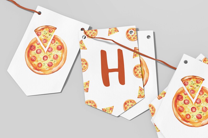 May include: A white banner with a pizza pattern and the letter "H" in orange. The banner is strung with brown twine and has holes for hanging.
