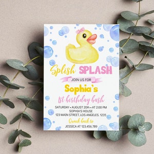 May include: A rectangular invitation card featuring a yellow rubber duck with a pink bow, surrounded by blue watercolor bubbles. The text reads: Splish Splash, Join Us For Sophia's 1st Birthday Bash, Saturday August 20th at 2:00 PM, Sophia's House, 123 Main Street, Los Angeles, 1235, Quack back to Jessica at 123.456.789.