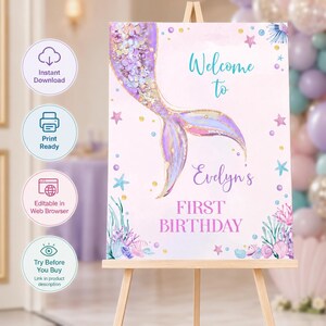 May include: A rectangular birthday welcome sign featuring a purple and gold glitter mermaid tail illustration on a light pink background. The text reads Welcome to Evelyn's FIRST BIRTHDAY, surrounded by watercolor starfish, shells, and coral.
