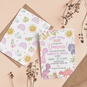 May include: A birthday invitation card and a matching patterned envelope liner featuring watercolor illustrations of dinosaurs, rainbows, suns, clouds, and flowers. The text reads: STOMP! CHOMP! ROAR! LET'S PARTY LIKE A DINOSAUR! MADISON'S 1ST BIRTHDAY.