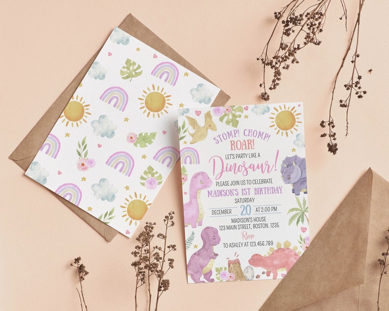 May include: A birthday invitation card and a matching patterned envelope liner featuring watercolor illustrations of dinosaurs, rainbows, suns, clouds, and flowers. The text reads: STOMP! CHOMP! ROAR! LET'S PARTY LIKE A DINOSAUR! MADISON'S 1ST BIRTHDAY.