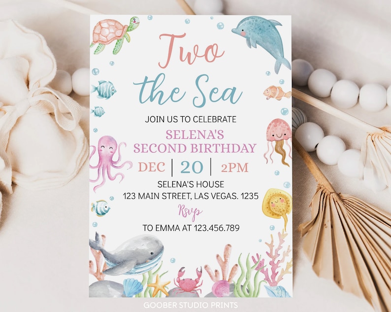 May include: A blue and pink invitation card with the text "Two the Sea" and a sea-themed design. The invitation is for Selena's second birthday party on December 20th at 2 PM. The address is 123 Main Street, Las Vegas, 1235. RSVP to Emma at 123.456.789.