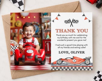 May include: A rectangular thank you card featuring a photo of a child in red overalls sitting in a red toy race car on the left, and text on the right reading THANK YOU, followed by a message and the name LOVE, OLIVER, with a race car illustration.