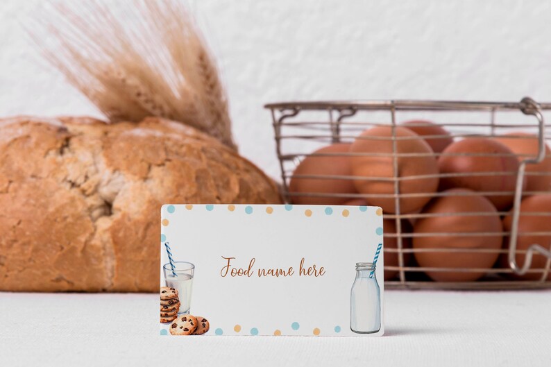 May include: A white card with blue and orange polka dots. The card has a picture of a glass of milk with a straw, cookies, and a bottle of milk. The text on the card reads "Food name here".