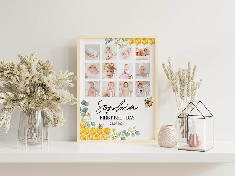 May include: A framed photo collage print featuring twelve baby portraits arranged in a grid. The design includes watercolor illustrations of honeycombs, bees, and flowers. The text reads Sophia, FIRST BEE - DAY, and the date 22.09.202X in black font.