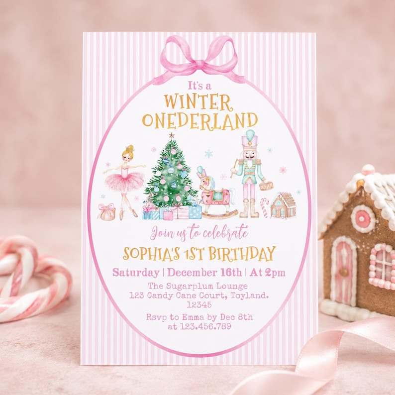 May include: A rectangular birthday invitation card with a pink and white striped background. It features a pink bow at the top, a ballerina, a Christmas tree, a rocking horse, and a nutcracker. Text reads: It's a WINTER ONEDERLAND, Join us to celebrate SOPHIA'S 1ST BIRTHDAY, Saturday | December 16th | At 2pm, The Sugarplum Lounge, 123 Candy Cane Court, Toyland, 12345, RSVP to Emma by Dec 8th at 123.456.789.