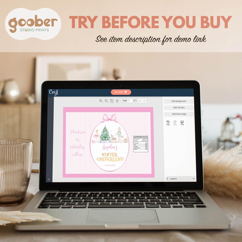 May include: A laptop screen displaying a digital design interface for a pink-themed party favor label. The label features a Christmas tree, a ballerina, a nutcracker, and the text 'Sophia's WINTER ONEDERLAND' inside an oval frame.