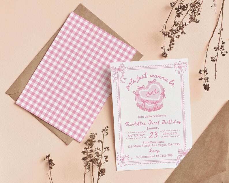 May include: A pink and white gingham patterned invitation card with a pink and white illustration of a heart-shaped cake with the text "girls just wanna be one" and the text "Join us to celebrate Charlotte's First Birthday" with the date and time of the party.