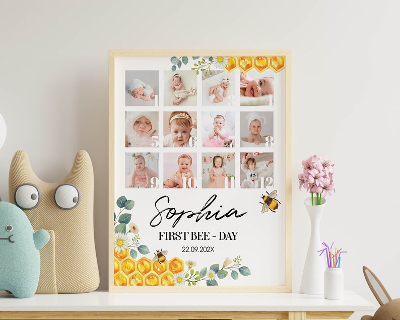 May include: A rectangular framed print featuring a twelve-photo collage of a baby, numbered one through twelve. The design includes watercolor illustrations of honeycombs, bees, and flowers. Text reads: Sophia, FIRST BEE - DAY, 22.09.202X.