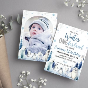 May include: A rectangular invitation card featuring a winter theme with blue snowflakes, a polar bear, penguins, an owl, and a seal. The text reads: JOIN US IN A Winter ONEderland TO CELEBRATE Cameron's 1st birthday SATURDAY | OCTOBER 28TH | AT 3PM.