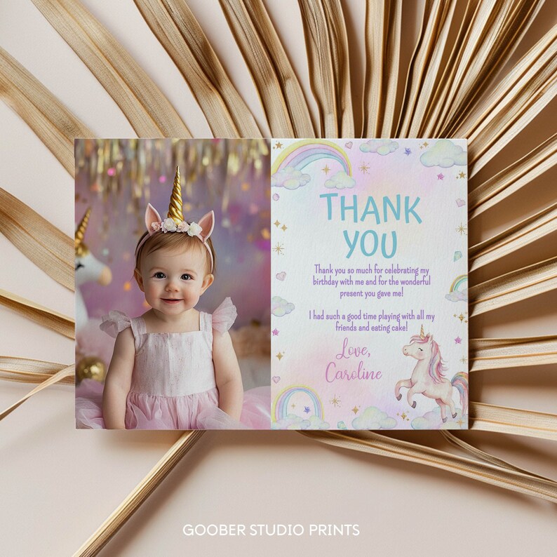 May include: A rectangular thank you card featuring a photo of a child wearing a unicorn headband with a gold horn and floral accents. The right side displays the text THANK YOU, a message of gratitude, and a watercolor illustration of a unicorn.