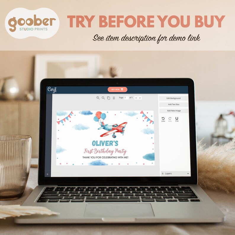 May include: A laptop screen displaying a digital invitation template for a first birthday party. The design features a watercolor airplane with balloons, blue clouds, and red bunting. Text reads: OLIVER'S First Birthday Party THANK YOU FOR CELEBRATING WITH ME!