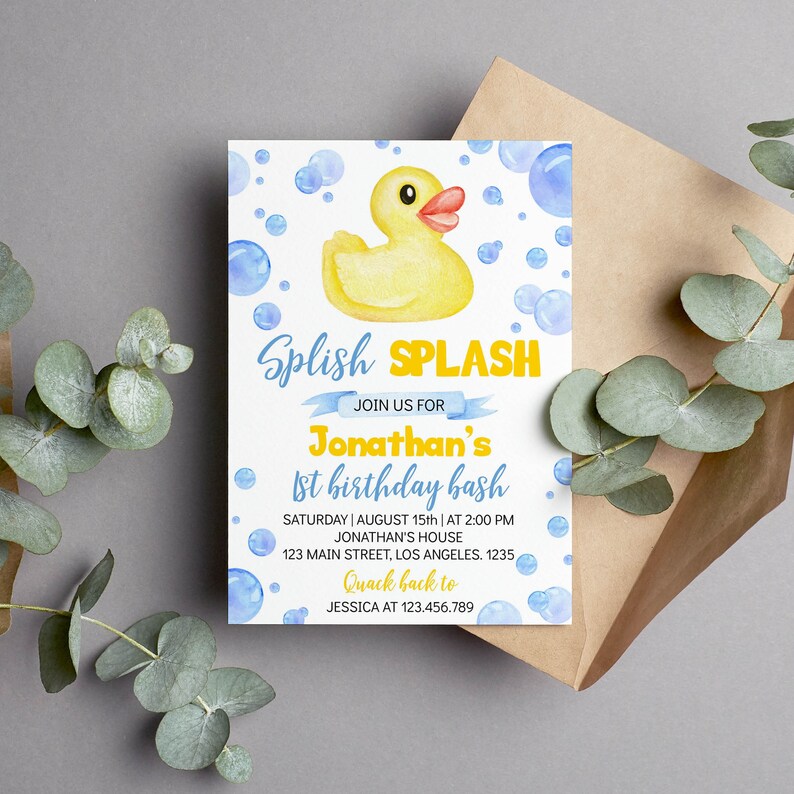 May include: A watercolor invitation with a yellow rubber duck, blue bubbles, and the text "Splish Splash." The invitation is for Jonathan's 1st birthday bash, with date, time, and location details. A brown envelope and eucalyptus leaves are in the background.
