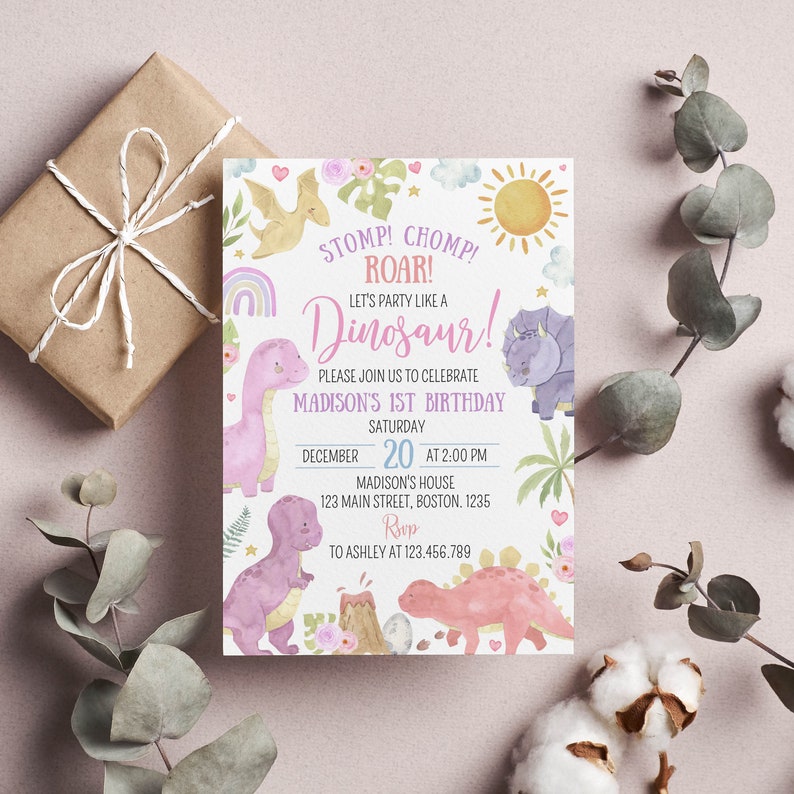 May include: A rectangular birthday invitation card featuring watercolor illustrations of dinosaurs, a sun, clouds, and flowers. The text reads: STOMP! CHOMP! ROAR! LET'S PARTY LIKE A DINOSAUR! PLEASE JOIN US TO CELEBRATE MADISON'S 1ST BIRTHDAY SATURDAY DECEMBER 20 AT 2:00 PM.