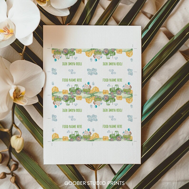 May include: Printable food labels featuring a green tractor with hay bales and blue balloons. The labels say "Food Name Here" repeated eight times.