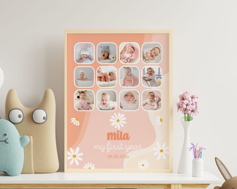 May include: A framed baby milestone photo collage. The collage features twelve small square photos of a baby, arranged in a grid. The background is peach with white daisy accents and the text "mila my first year" in a soft orange font.
