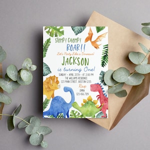 May include: A rectangular invitation card featuring watercolor illustrations of a yellow triceratops, a blue long-necked dinosaur, a green stegosaurus, a red dinosaur, and an orange pterodactyl surrounded by green tropical leaves and text.