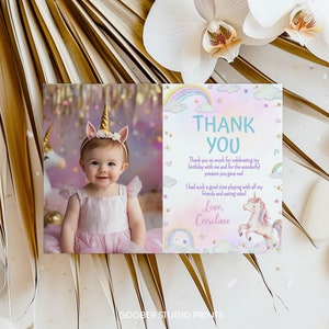 May include: A rectangular thank you card featuring a photograph of a child wearing a gold unicorn horn headband on the left side. The right side displays pastel rainbow, cloud, and unicorn illustrations with the text Thank You and Love, Caroline.