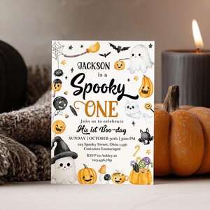 May include: A rectangular Halloween-themed invitation card featuring watercolor illustrations of ghosts, pumpkins, bats, and candy. The text reads: Jackson is a Spooky ONE, Join us to celebrate His 1st Boo-day, Sunday, October 30th, 5:00 PM, 123 Spooky Street, Ohio.
