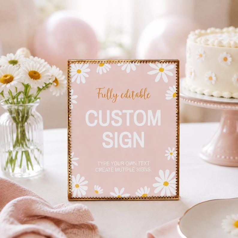 May include: A rectangular sign with a gold-toned beaded frame featuring a light pink background decorated with white daisy illustrations. The text reads: Fully editable, CUSTOM SIGN, TYPE YOUR OWN TEXT, CREATE MUTIPLE SIGNS.