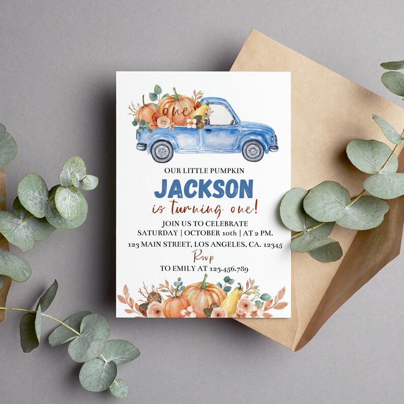 May include: A white rectangular invitation card featuring a watercolor blue truck carrying pumpkins and the text: OUR LITTLE PUMPKIN JACKSON is turning one! JOIN US TO CELEBRATE SATURDAY OCTOBER 10th AT 2 PM. 123 MAIN STREET, LOS ANGELES, CA. 12345 RSVP TO EMILY AT 123-456-789.