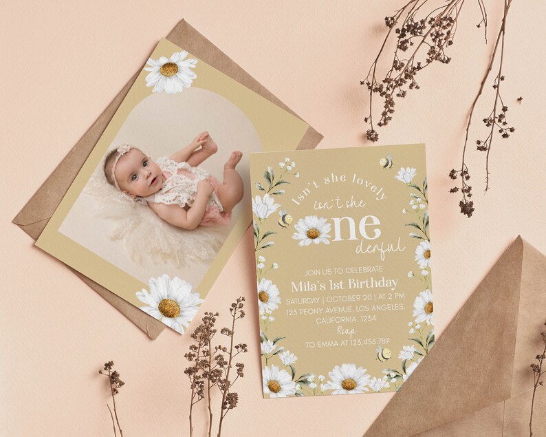 May include: A first birthday invitation card featuring white daisy illustrations, small bees, and the text "Isn't she lovely, isn't she one-derful, join us to celebrate Mila's 1st birthday, Saturday, October 20, at 2 PM, 125 Peony Avenue, Los Angeles, California, 1254, RSVP to Emma at 123.456.789."