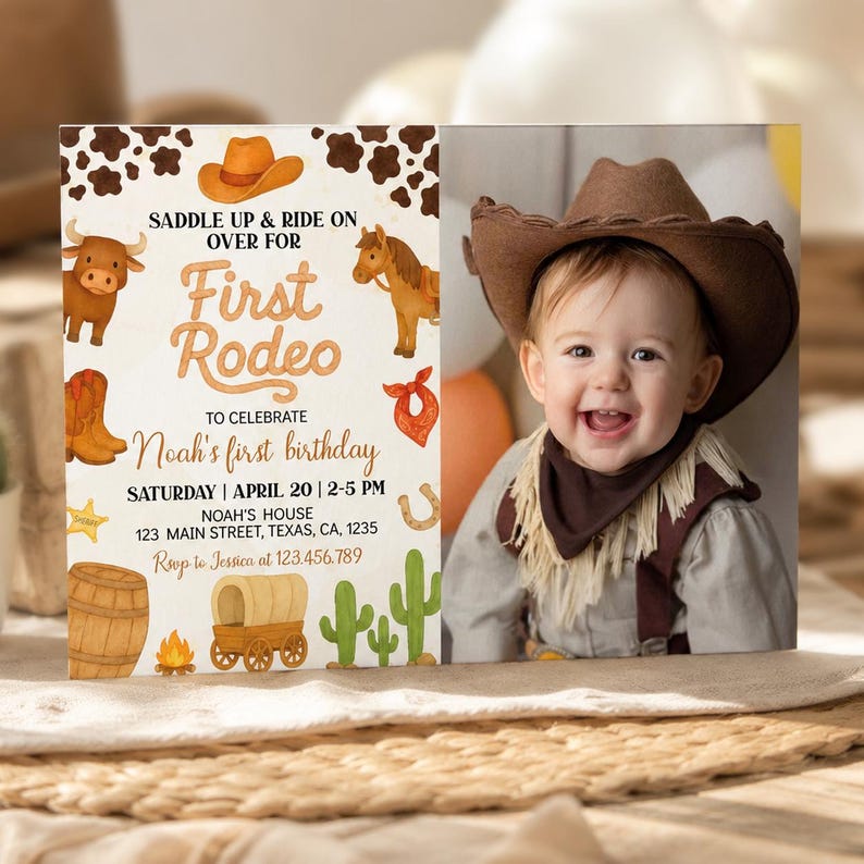 May include: A rectangular birthday invitation card featuring a western theme with illustrations of a cowboy hat, cow, horse, boots, bandana, barrel, wagon, and cacti. The text reads SADDLE UP & RIDE ON OVER FOR First Rodeo TO CELEBRATE Noah's first birthday.