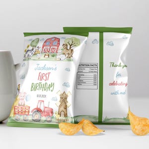 May include: A custom chip bag featuring a watercolor farm theme with a red barn, tractor, and animals. The text reads Jackson's FIRST BIRTHDAY 10.01.202X, with a nutrition facts label listing friendship and love, and the text Thank you for celebrating with me.