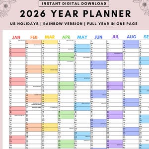 Peut inclure: Un planificateur annuel 2026 avec un schéma de couleurs arc-en-ciel. Le calendrier affiche les jours fériés américains et une année complète sur une page. Les mois sont clairement indiqués.