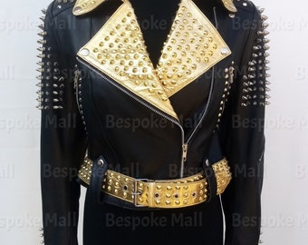 May include: Black leather jacket with gold studded collar and belt. The jacket has silver spikes on the shoulders and sleeves.