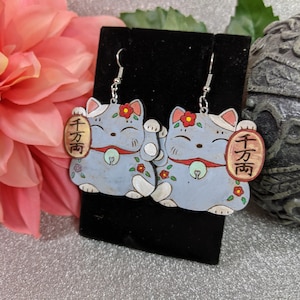 Maneki neko, or beckoning cat, is a common Japanese figurine meant to bring good luck to the owner. This could be a gift for any occasion.