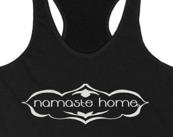 May include: Black tank top with a white graphic that says "namaste home" in a decorative font.