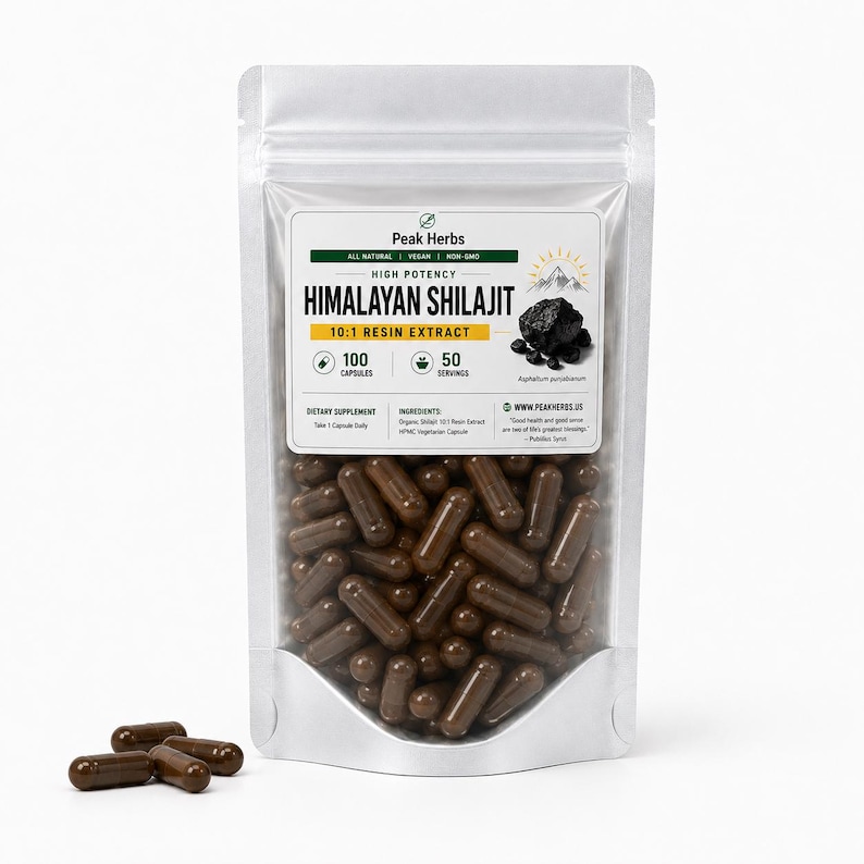 May include: A silver pouch of Peak Herbs Himalayan Shilajit 10:1 Resin Extract capsules. The label indicates 100 capsules and 50 servings. The capsules are brown and visible inside the pouch and scattered in front of it.