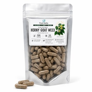 May include: A silver pouch filled with brown capsules, labeled "HORNY GOAT WEED" with "Peak Herbs" branding. The label indicates 100 capsules and 33 servings, with text stating "ALL NATURAL", "VEGAN", and "NON-GMO".
