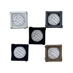 May include: Five square patches with embroidered volleyball designs. The patches are in various colors: white, gray, black, navy, and brown. Each patch features a white volleyball design.