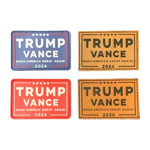 May include: Four rectangular patches with the text "TRUMP VANCE" and "MAKE AMERICA GREAT AGAIN! 2024". Two patches are tan, one is red, and one is blue. Each patch has a border and star accents.