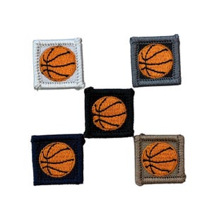 May include: Five square patches with an orange basketball design. Each patch has a different coloured border: white, grey, black, navy blue, and brown. The basketballs have black lines.