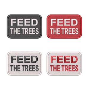 May include: Four embroidered patches with the text "FEED THE TREES". The patches are rectangular with rounded corners. Colors include black, red, white, and grey. The text is in a bold, sans-serif font.